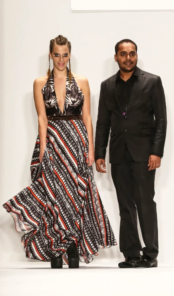 من-نحن-علامة-أزياء-مستدامة 1 Srikanth Yeddula founder of sustainable fashion brand, Shrekahnth and Juliette Dechy bowing on the runway after the Spring/Summer 2015 collection showcase at New York Fashion Week.